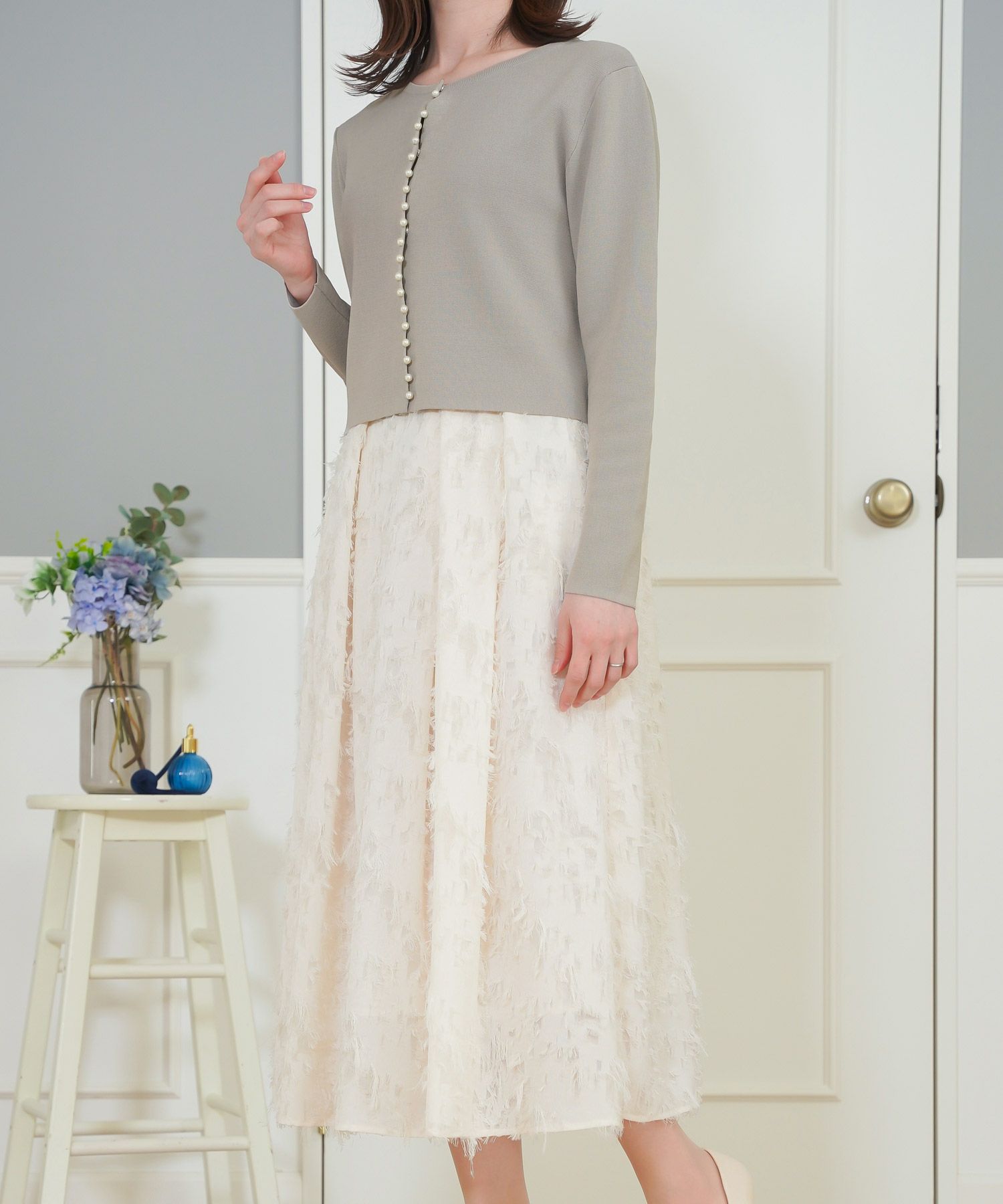 Taupe knee high boots with cream midi skirt
